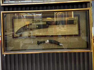 Framed Decorative Rifle and Traditional Dagger Display
