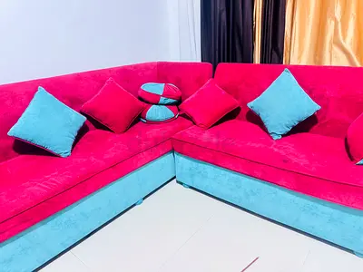 Red and Turquoise L-shaped Velvet Sofa with Cushions