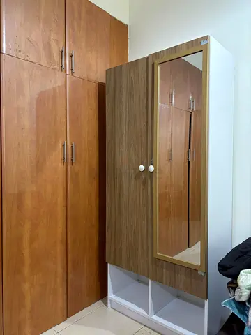 Compact wardrobe with mirror and storage cubbies - good condition