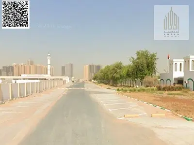 أرض زاوية شارعين للبيع في عجمان تملك حر للجميع