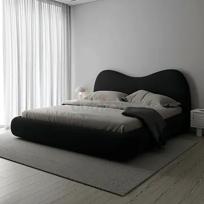 Modern black upholstered double bed with curved headboard