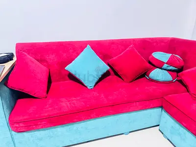 Red and Turquoise L-shaped Velvet Sofa with Cushions