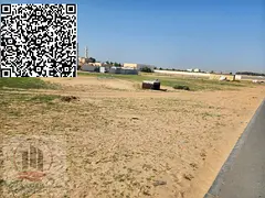 A corner residential investment plot of land on two paved streets for sale in Al Tallah 2, Ajman