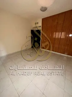Two-bedroom apartment for annual rent in Al Majaz 3, prime location behind Nesto and close to Al Saf