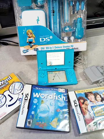 Nintendo DSi with Accessories+ games