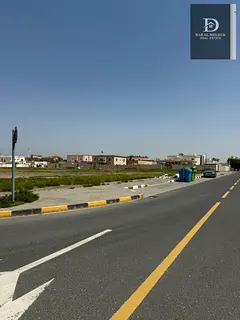 For Sale in Sharjah, Al Tarfa Area Residential Land On two streets, 18 meters wide and 12 meters wid