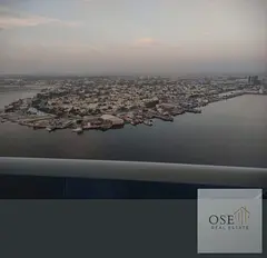 Two-bedroom apartment with a living room in Al Waha Towers, with a full sea view, for a monthly inst