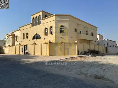 Corner villa for sale in Al Muwaihat 3 | 8000 sq ft | Two floors + roof | 4 independent apartments | 11 master bedrooms | Suitable for 4 families | Pr
