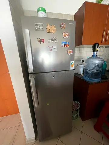 Used double-door stainless steel refrigerator - good working condition