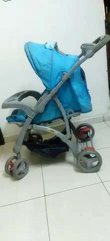 Lightweight blue baby stroller in used but good condition