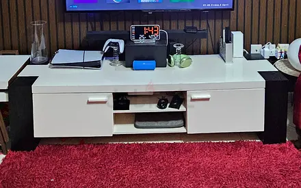 White TV Entertainment Unit with Black Accent Panels — Good Condition