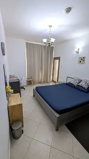 Furnished master bedroom with balcony for couple