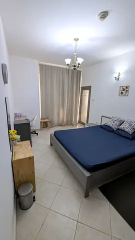 Furnished master bedroom with balcony for couple