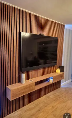 Wall-mounted TV panel with floating shelf - walnut finish