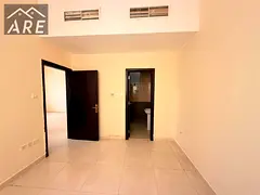 A 2-bedroom apartment with a spacious living room is available for annual rent in Al Jurf 2