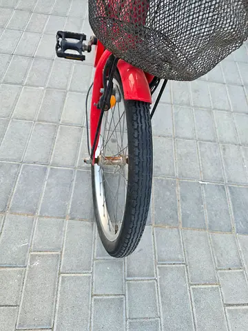 Red Spartan city bicycle with front basket — good working condition for age 5 to 9