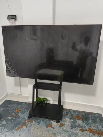 65-inch Flat Smart TV (Good working condition) on Mobile Stand