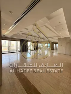 🔹 Luxury penthouse in Al Majaz, 3-5 bedrooms, living room with roof and full sea view
