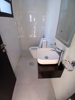 Two bedrooms, a living room, three bathrooms, a kitchen, and a balcony in Al Jurf 3, Ajman, with par