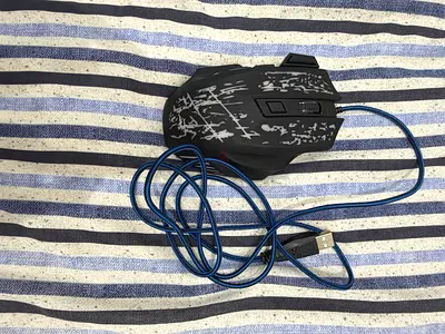 Keyboard and 2 mouse’s one is razed white and the second is black and blue mouse and  a gaming keybo