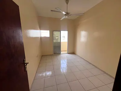 Two-bedroom apartment with a living room for annual rent in Al Rawda 3, Ajman. Located on Sheikh Ammar Street in a vibrant and well-served area close