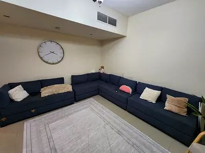 Large L-shaped navy fabric sectional sofa — comfortable family seating