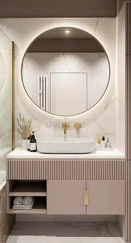 Modern bathroom vanity with round illuminated mirror and basin
