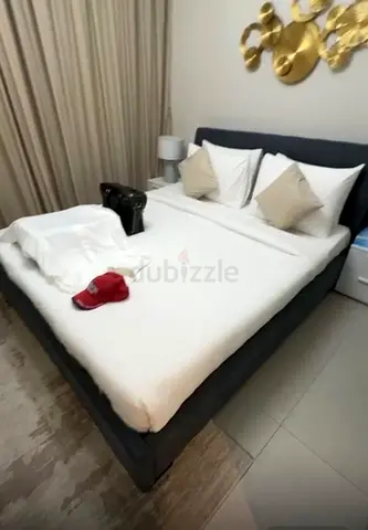 King-sized upholstered bed frame with mattress - dark blue