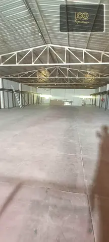 Storage warehouse 10,000 sq ft UAQ (5,500 ground + 4,500 mezzanine), 15kW, main road, AED 250K yearly