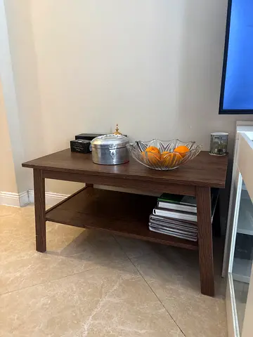 Simple wooden coffee table with shelf - good condition