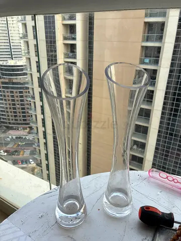 Used Set of 2 Clear Glass Decorative Vases (Tall, Slim Neck) one with dent