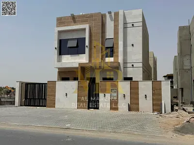 Two-story villa with a rooftop terrace, priced inclusive of registration, ownership, electricity, and water fees, in one of Ajman's most prestigious a