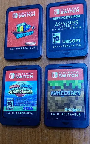 4 Nintendo Switch Game- Assassins Creed, Minecraft, Super Mario Odyssey, Mariosonic olympic game