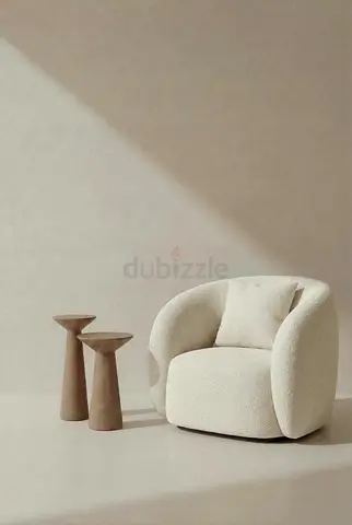 Cream boucle swivel lounge chair with cushion