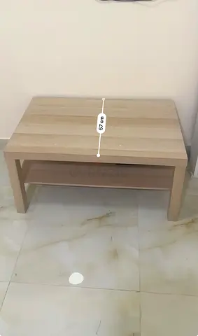 Light wood coffee table with lower shelf - good condition