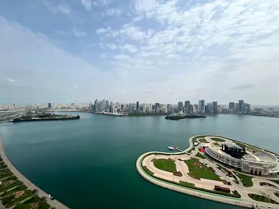 Stunning sea view with a balcony overlooking Al Majaz Amphitheatre. Three-bedroom apartment with a spacious living room, including a master bedroom,