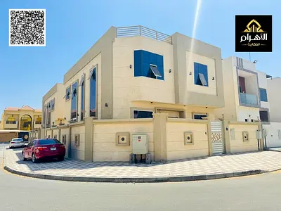 Own a villa for sale with a modern design in Al Yasmeen area, Ajman (two floors) (including water, electricity, and air conditioning). Prime location,