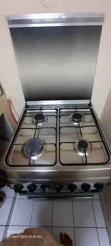 Used 4-Burner Stainless Steel Gas Stove with Oven