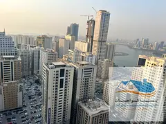 Sharjah, Al Khan, Rose Tower: a 2-bedroom apartment with a living room, 2 bathrooms, and a kitchen,