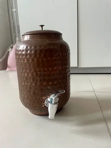 Vintage hammered copper water dispenser with tap