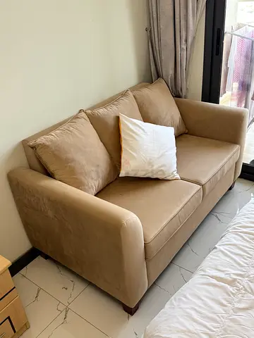 Stylish modern sofa in excellent condition | Chic beige color | 500 AED