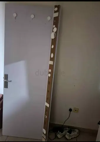 Tall white wardrobe/armoire door with hooks - used