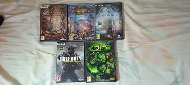 Collection of 5 PC Games — World of Warcraft, Call of Duty, King’s Quest , Home World, Warhammer.