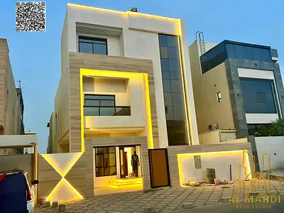 Two-story villa with a roof terrace, priced inclusive of electricity and water fees, located on the main street, ready for occupancy in one of Ajman's