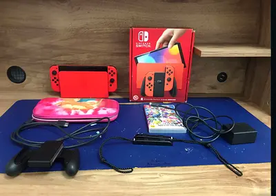 Nintendo Switch oled (Mario limited edition) Console with super smash bros ultimate + Accessories