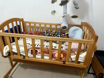 Wooden Baby Cradle/Bassinet with baby light and sound toy and mosquito/fly net as new condition