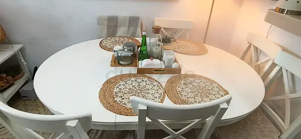White Oval Dining Table with 6 Cross-Back Chairs - Good Condition