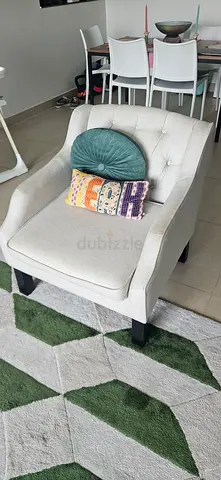 Light beige upholstered accent chair with tufted back — good condition small tear in right arm 500