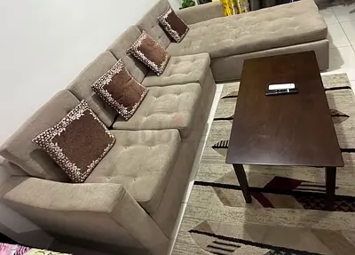 L-shaped beige fabric sectional sofa without chaise