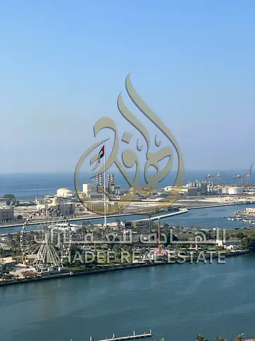 For Rent in Sharjah, Al Majaz 1: Luxurious 3-bedroom apartment with a direct sea view, featuring a large private terrace, maid’s room, laundry room, b